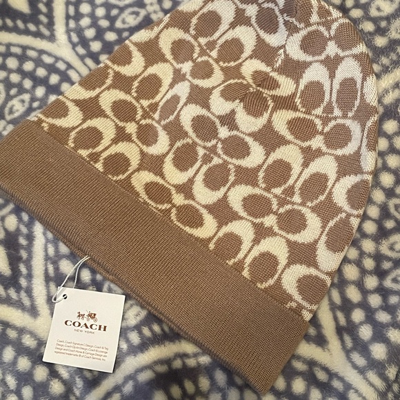 Coach Accessories - Tan Coach logo hat/beanie. New with tags.